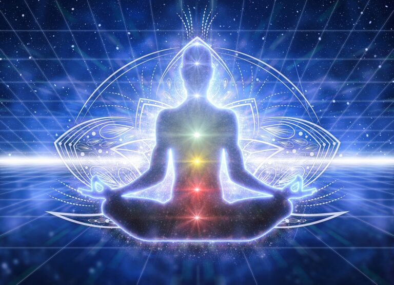 Meditating figure with aligned chakras and radiant energy field
