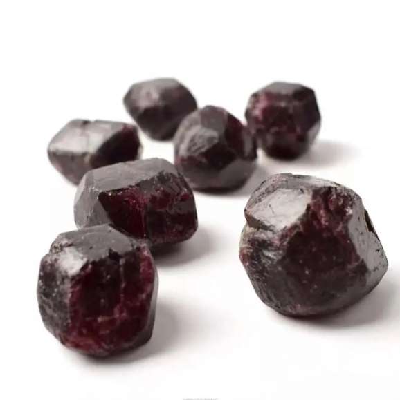 Raw red Garnet (Almandine) crystal in dodecahedral shape – member of the cubic crystal system.