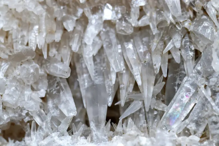 Natural cluster of sharp transparent calcite crystals growing in random directions, creating a stunning geometric effect.
