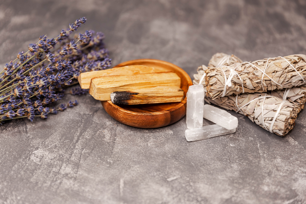 Cleansing kit with Palo Santo, sage bundle, selenite stick, and lavender for spiritual energy clearing