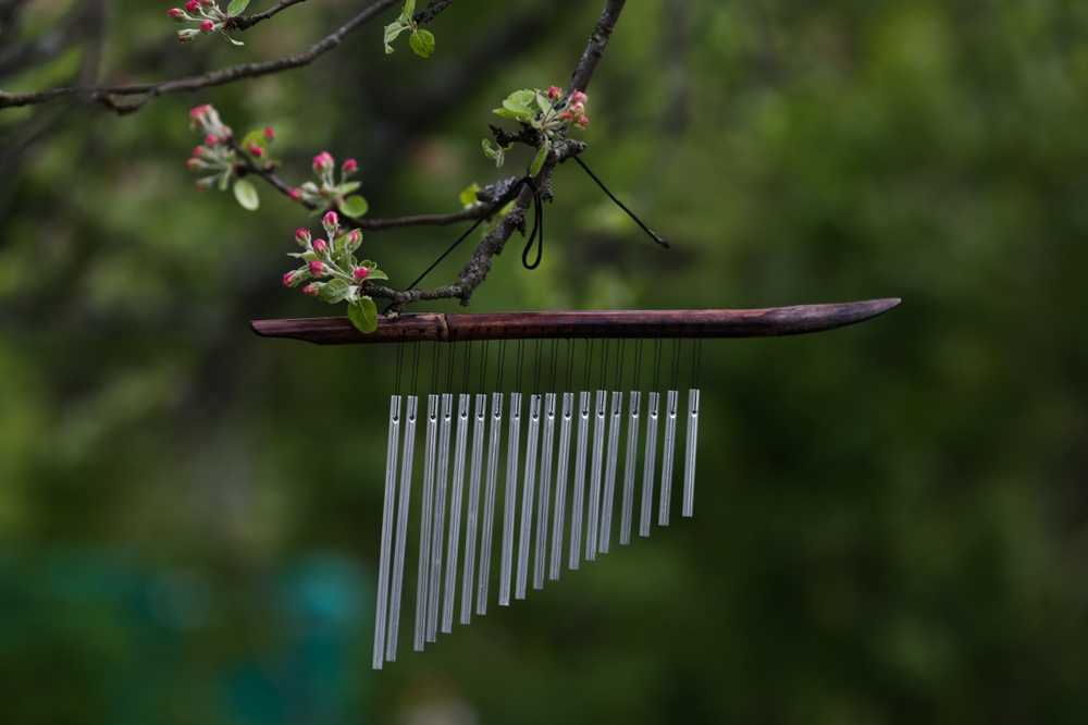 Wind chime hanging outdoors, used for sound cleansing and energy harmonizing