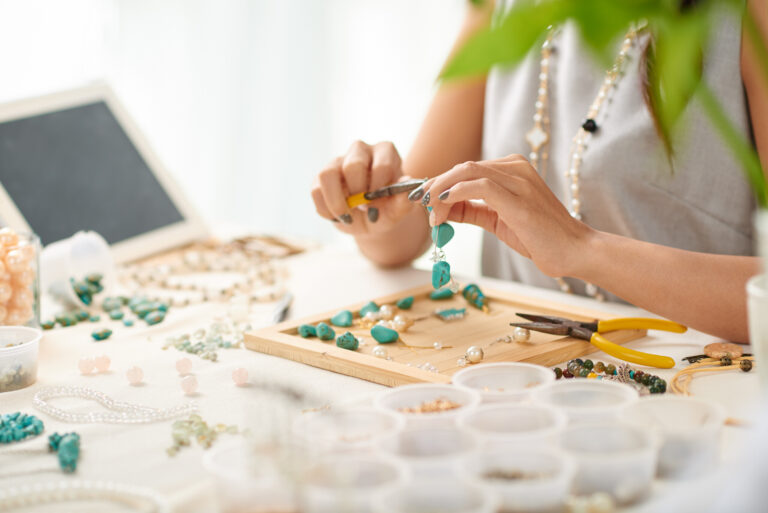 Handmade crystal jewelry design process with turquoise and gemstone beads